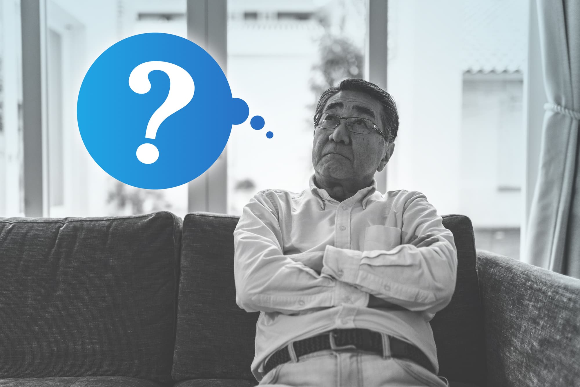 インプラント治療は痛いのか考える男性